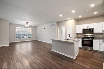 Spacious living rooms with plank flooring